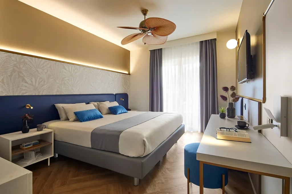 arredamento hotel camera letto illuminazione spazi caldi